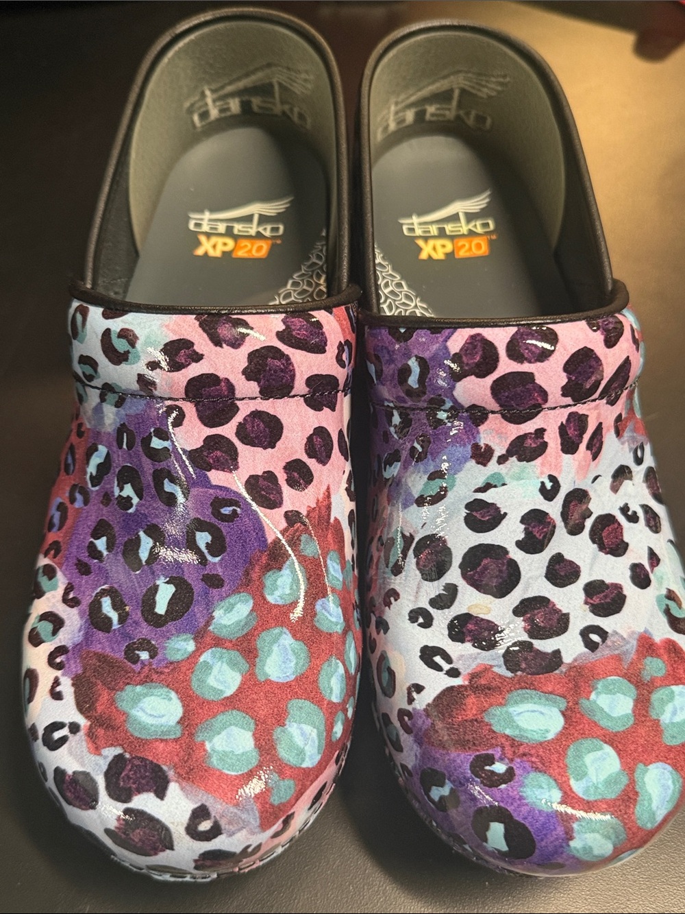 Dansko Multicolor Leopard Print Clogs in Purple, Teal, Red and Black